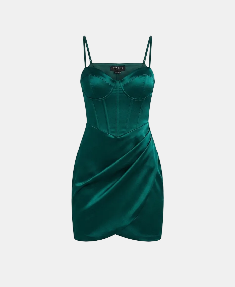 A dark emerald green satin mini dress with a corset-style bodice and thin spaghetti straps, shown against a light gray background.