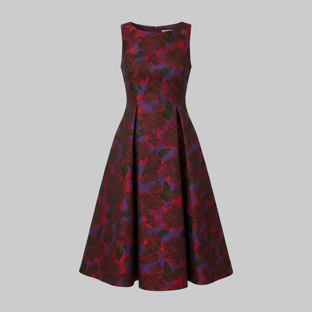 A sleeveless A-line dress with a floral jacquard pattern in deep red and purple, shown against a light gray background.