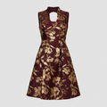 A sleeveless A-line dress in deep burgundy with a metallic gold floral print, featuring a high keyhole neckline, shown on a light gray background.