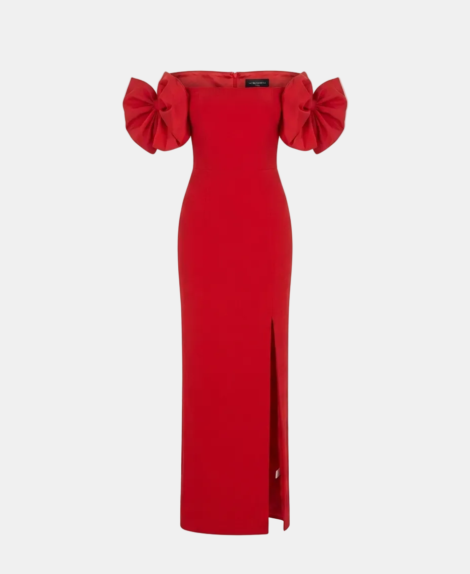 A bright red off-the-shoulder midi dress with voluminous ruffled sleeves and a front slit, shown on a light gray background.