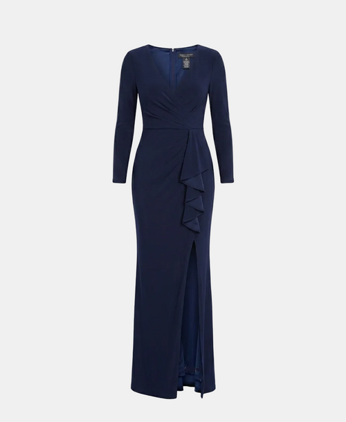 A navy blue long-sleeve maxi dress with a wrap-style V-neckline, ruffled detailing at the waist, and a front slit, shown on a light gray background.