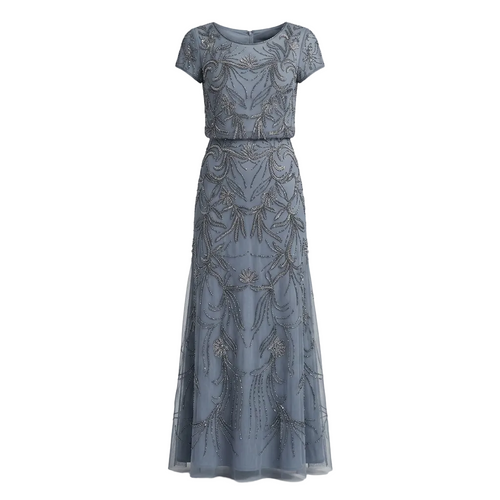 A floor-length dusty blue gown with short cap sleeves, featuring intricate silver beaded floral and scroll patterns across the tulle fabric, shown against a neutral gray background.