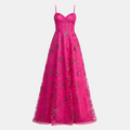 A bright pink lace formal gown with thin shoulder straps, a fitted corset-style bodice, and a full flared skirt, shown against a plain light background.